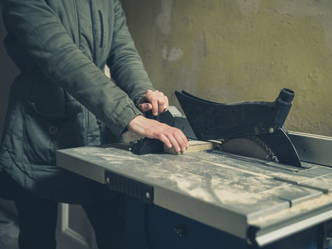 Young person operating tablesaw