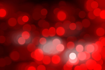 Bokeh light, shimmering blur spot lights on red abstract 