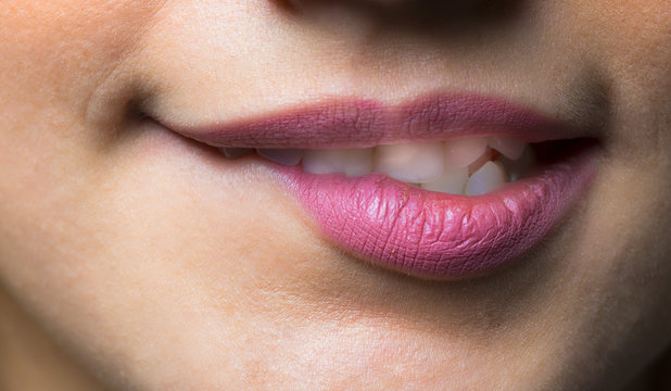 Close-up of woman's lips with fashion natural rose lipstick makeup