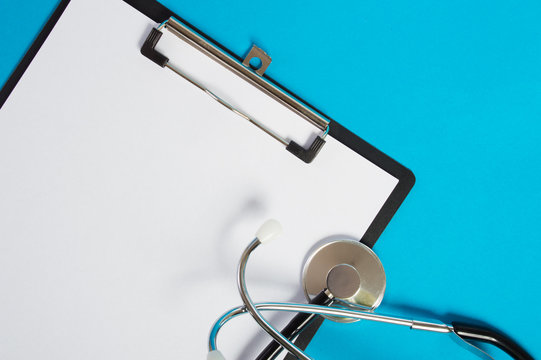 stethoscope and folder on blue background for a doctor in the clinic for patients