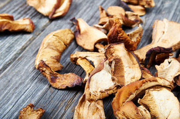 Dried mushrooms on wooden background
