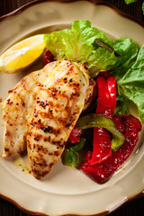 Grilled chicken breasts served with grilled paprika