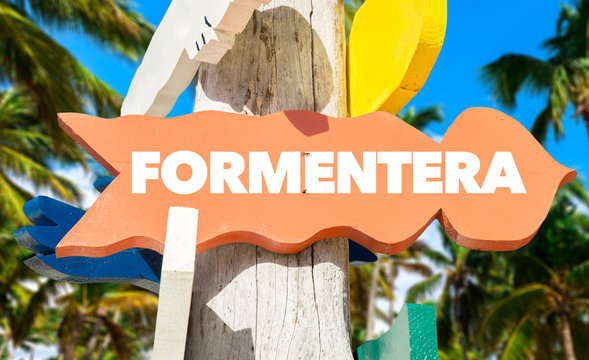 Formentera welcome sign with palm trees
