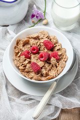 Bowl of cereals with raspberrie.