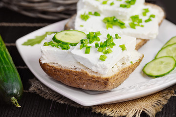 bread with curd cheese and chives.Shallow depth of field