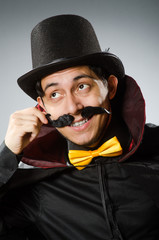 Funny magician man wearing tophat