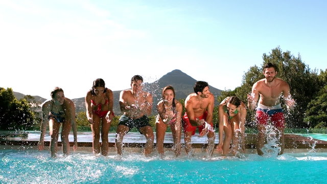 Happy friends having fun in the water 