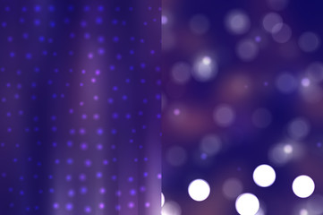 Bokeh light, shimmering blur spot lights on violet abstract back