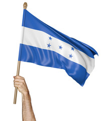 Hand proudly waving the national flag of Honduras