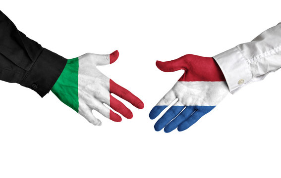 Italy and Netherlands leaders shaking hands on a deal agreement