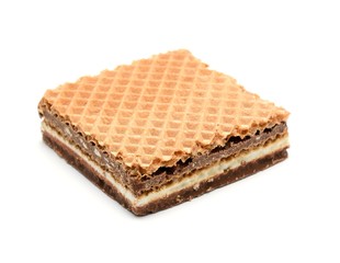 Wafer with hazelnut and milk cream on white background.