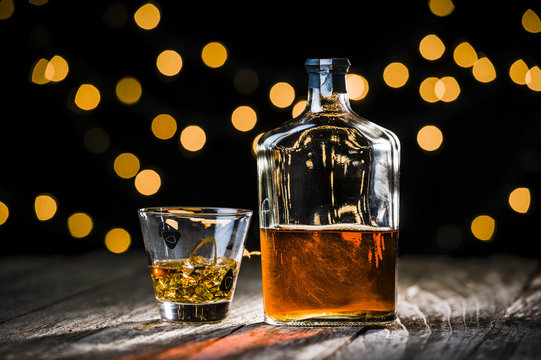 a bottle and glass of whiskey