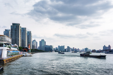 Fototapeta na wymiar Self-propelled barges on the Huangpu River. Shanghai, China
