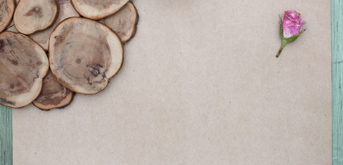 Pink roses on wooden and craft background