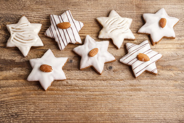 Gingerbread cookies in star shape decorated with almonds on brow