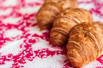 Croissants, big, delicious croissants on a table. Fresh bakery