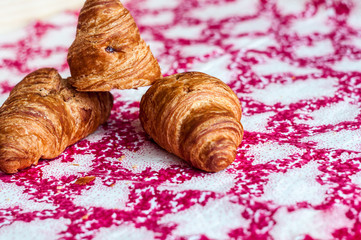 Croissants, big, delicious croissants on a table. Fresh bakery