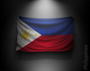 waving flag Philippines on a dark wall