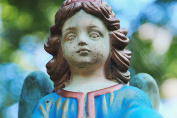 Vintage image of a sad angel on a cemetery