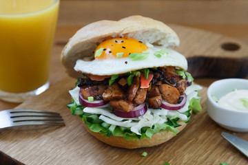 Closeup of a grilled chicken burger with teriyaki