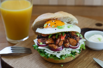Chicken burger on wooden table