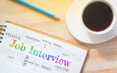 Concept Job Interview message on book. A pencil and a glass coffee table.Vintage tone.