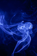 Blue smoke on a black background.