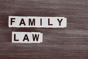 Blocks with letters regarding child-custody and family-law concept. Retro stylization
