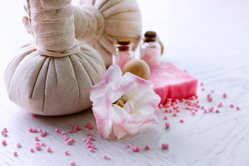 Beautiful composition of spa treatment on a white wooden table