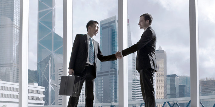 Asian Business Handshake Agreement Partnetship Concept