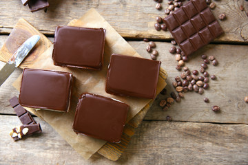 Delicious chocolate brownies on wooden background