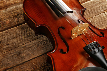 Violin on wooden background