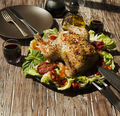  baked chicken with herbs spices ingredients, selective focus