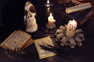 Magic still life with candles and the tarot cards