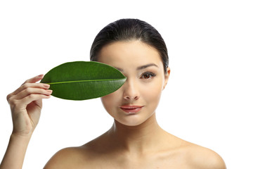Portrait of beautiful woman with green leaf which isolated on white background