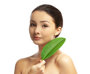Portrait of beautiful woman with green leaf which isolated on white background