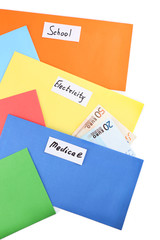 Colourful envelopes with money for needs isolated on white background