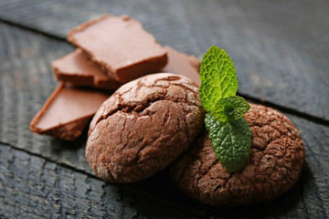 Chocolate chip cookie with chocolate pieces and mint, closeup