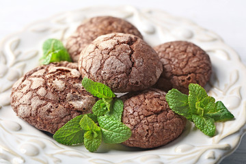 Chocolate chip cookie with mint in plate, closeup