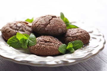 Chocolate chip cookie with mint in plate, closeup