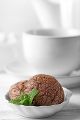 Chocolate chip cookie in plate with mint, closeup
