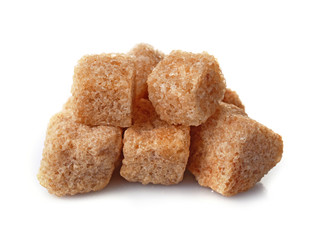 Pile of brown sugar cubes isolated on white background