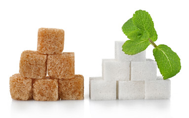 Pile of sugar cubes and stevia isolated on white background