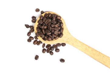 Coffee beans in an old wooden scoop
