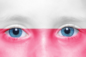 child's face with polish flag