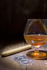 Cognac in glass and cigar