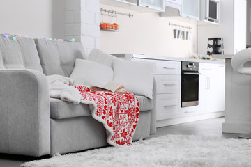 Living room interior with grey sofa and pillows