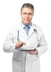 A handsome doctor with stethoscope and tablet, isolated on white