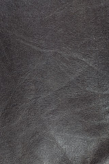 Dark brown real leather surface.