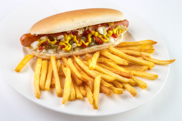 Hot dog and french fries on white plate..